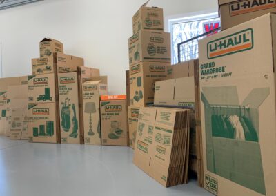 Stacked moving boxes in storage